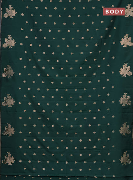 Semi soft silk saree dark green with allover zari woven buttas with zari woven bird butta border