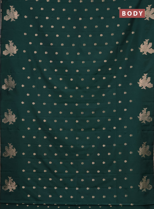 Semi soft silk saree dark green with allover zari woven buttas with zari woven bird butta border