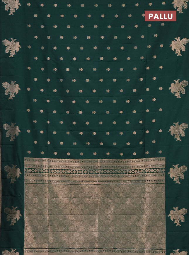 Semi soft silk saree dark green with allover zari woven buttas with zari woven bird butta border
