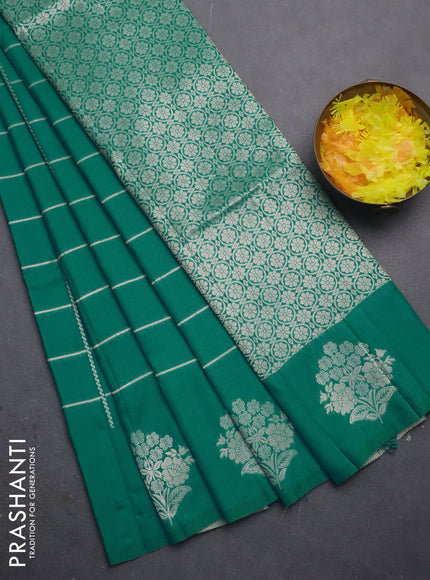 Semi soft silk saree teal green shade with allover zari woven checked pattern and zari woven floral butta border