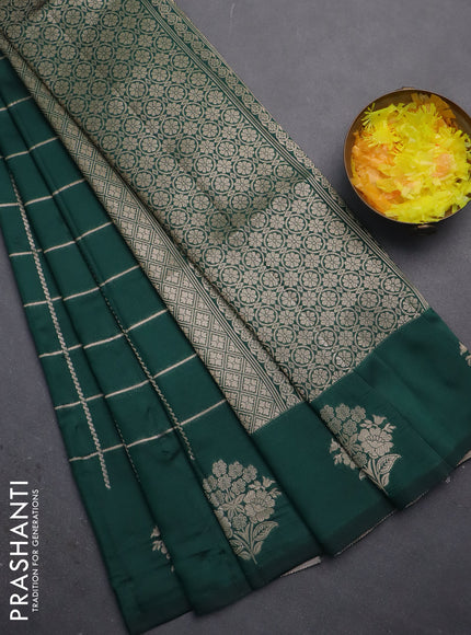 Semi soft silk saree green with allover zari woven checked pattern and zari woven floral butta border