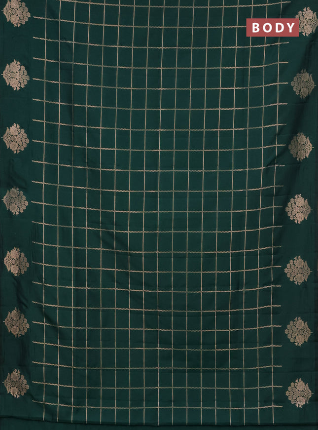 Semi soft silk saree green with allover zari woven checked pattern and zari woven floral butta border
