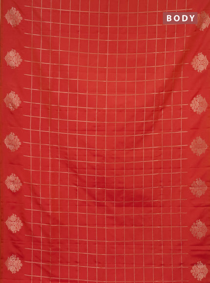 Semi soft silk saree dual shade of pinkisha orange with allover zari woven checked pattern and zari woven floral butta border