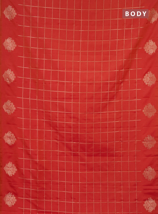 Semi soft silk saree dual shade of pinkisha orange with allover zari woven checked pattern and zari woven floral butta border