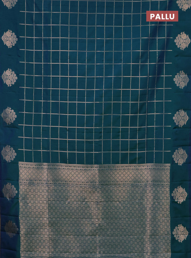 Semi soft silk saree dual shade of greenish blue with allover zari woven checked pattern and zari woven floral butta border