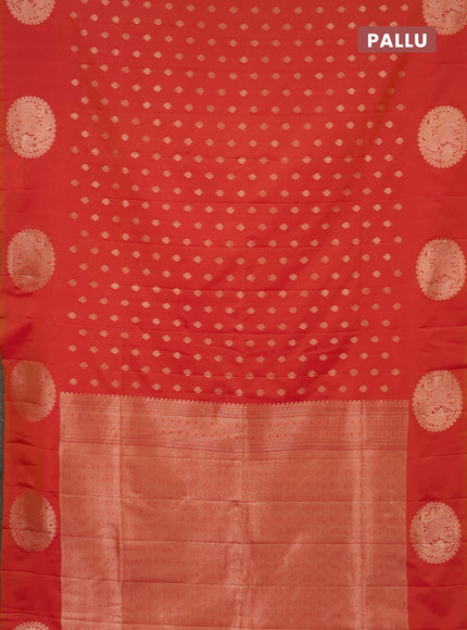 Semi soft silk saree dual shade of pinkish orange with allover zari woven buttas and zari woven butta border