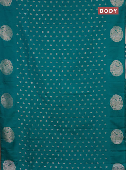 Semi soft silk saree green with allover zari woven buttas and zari woven butta border