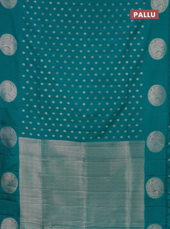 Semi soft silk saree green with allover zari woven buttas and zari woven butta border