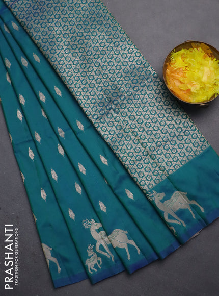 Semi soft silk saree dual shade of greenish blue with allover zari woven buttas and zari woven deer butta border