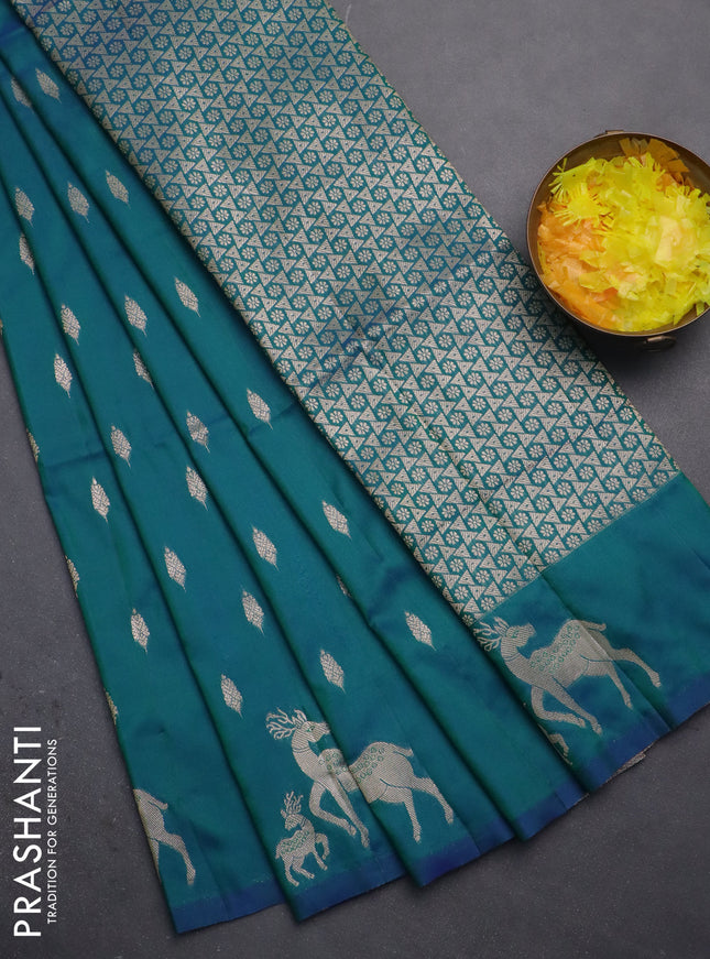 Semi soft silk saree dual shade of greenish blue with allover zari woven buttas and zari woven deer butta border