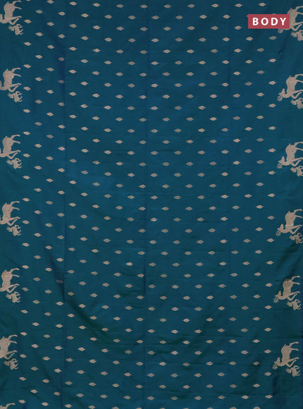 Semi soft silk saree dual shade of greenish blue with allover zari woven buttas and zari woven deer butta border