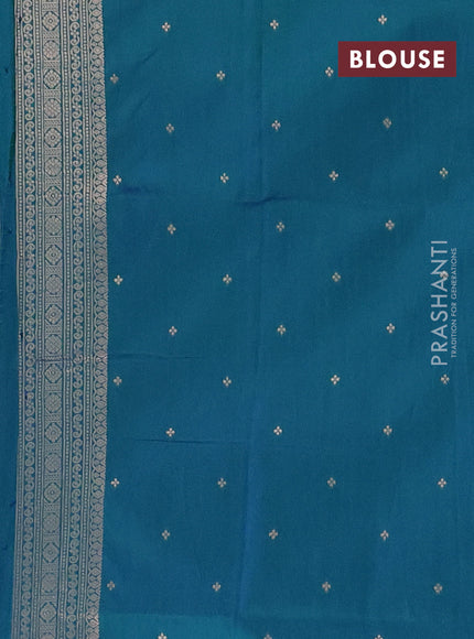 Semi soft silk saree dual shade of greenish blue with allover zari woven buttas and zari woven deer butta border