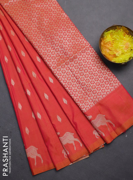 Semi soft silk saree dual shade of pinkish orange with allover zari woven buttas and zari woven deer butta border