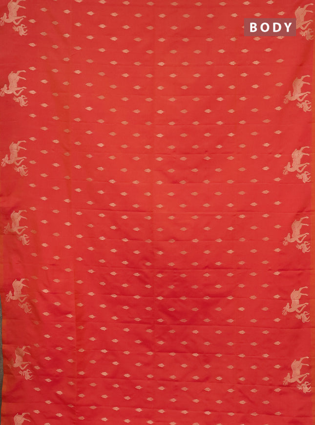 Semi soft silk saree dual shade of pinkish orange with allover zari woven buttas and zari woven deer butta border