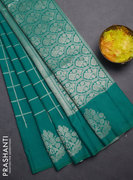 Semi soft silk saree teal green shade with allover zari woven checked pattern with zari woven butta border