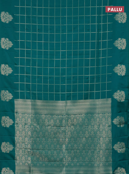 Semi soft silk saree teal green shade with allover zari woven checked pattern with zari woven butta border