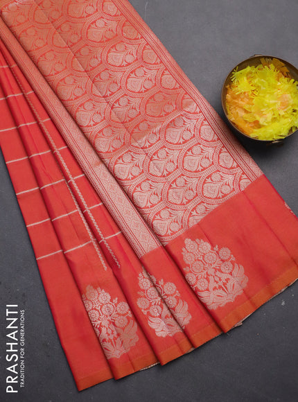 Semi soft silk saree dual shade of pinkish orange with allover zari woven checked pattern with zari woven butta border