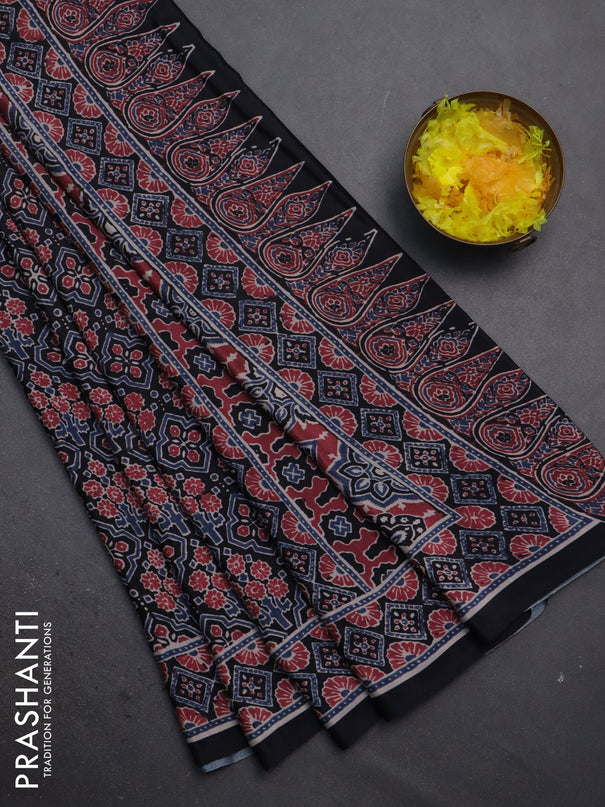 Semi crepe saree black with allover prints and printed border