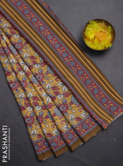 Semi crepe saree mustard yellow with allover kalamkari prints and printed border