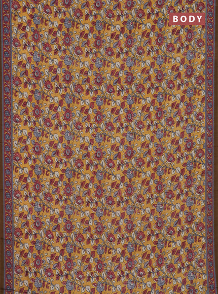 Semi crepe saree mustard yellow with allover kalamkari prints and printed border
