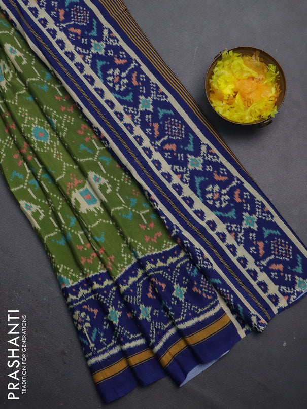 Semi crepe saree green and blue with allover ikat prints and printed border