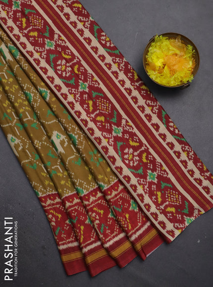 Semi crepe saree sandal and maroon with allover ikat prints and printed border