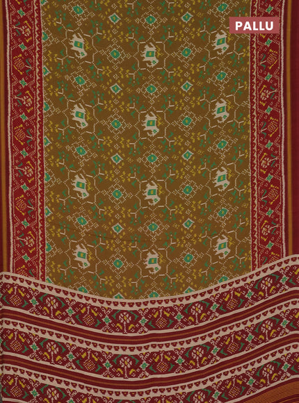 Semi crepe saree sandal and maroon with allover ikat prints and printed border