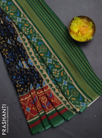 Semi crepe saree black and green with allover ikat prints and printed border