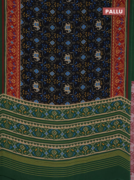 Semi crepe saree black and green with allover ikat prints and printed border