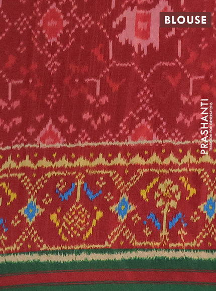 Semi crepe saree black and green with allover ikat prints and printed border