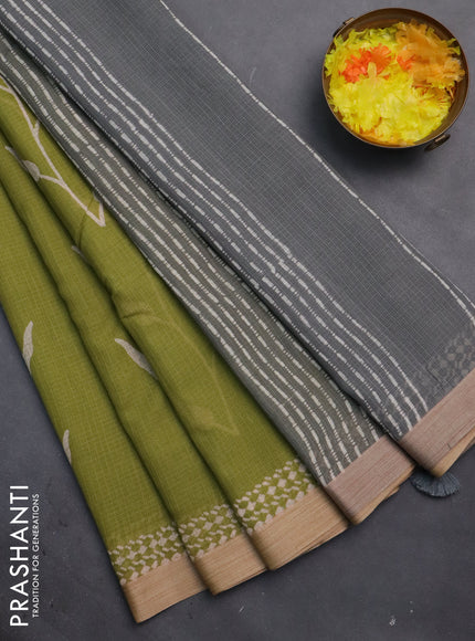 Kota silk cotton saree light green and grey with allover block prints and simple border