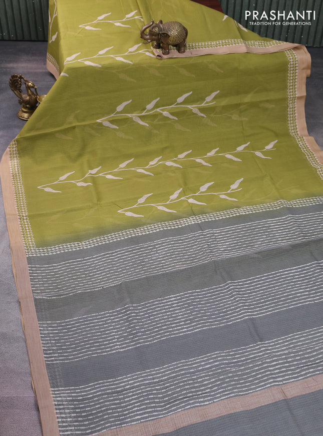 Kota silk cotton saree light green and grey with allover block prints and simple border