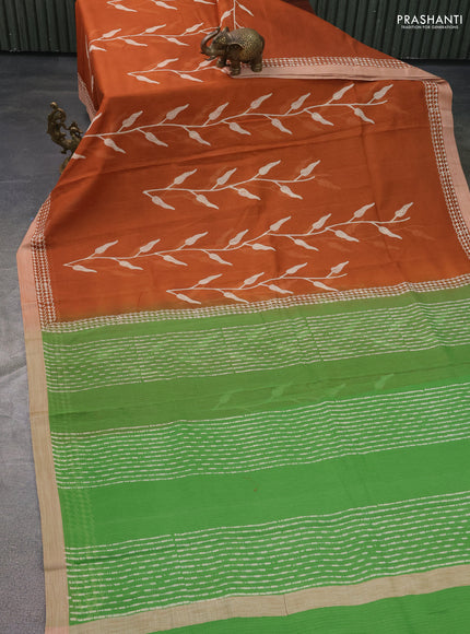Kota silk cotton saree rust shade and green with allover block prints and simple border