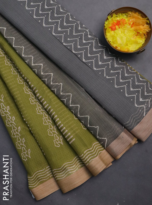 Kota silk cotton saree light green and grey with allover block prints and simple border