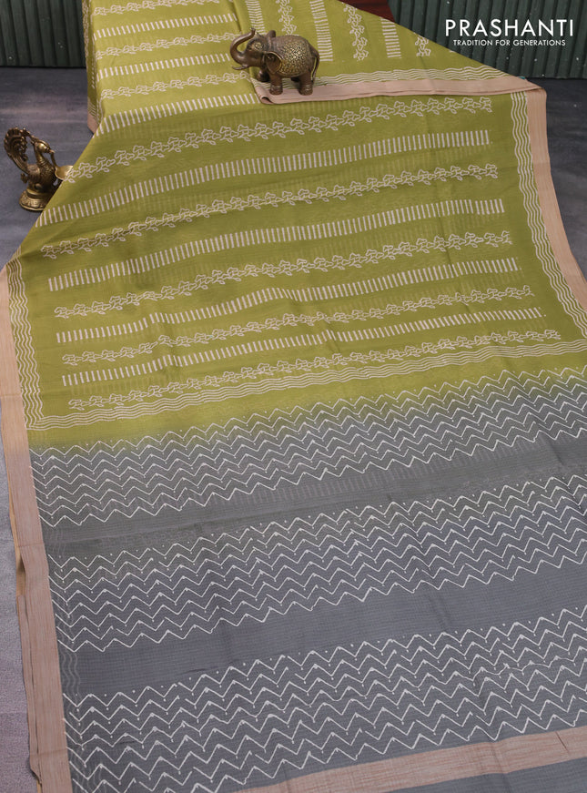 Kota silk cotton saree light green and grey with allover block prints and simple border