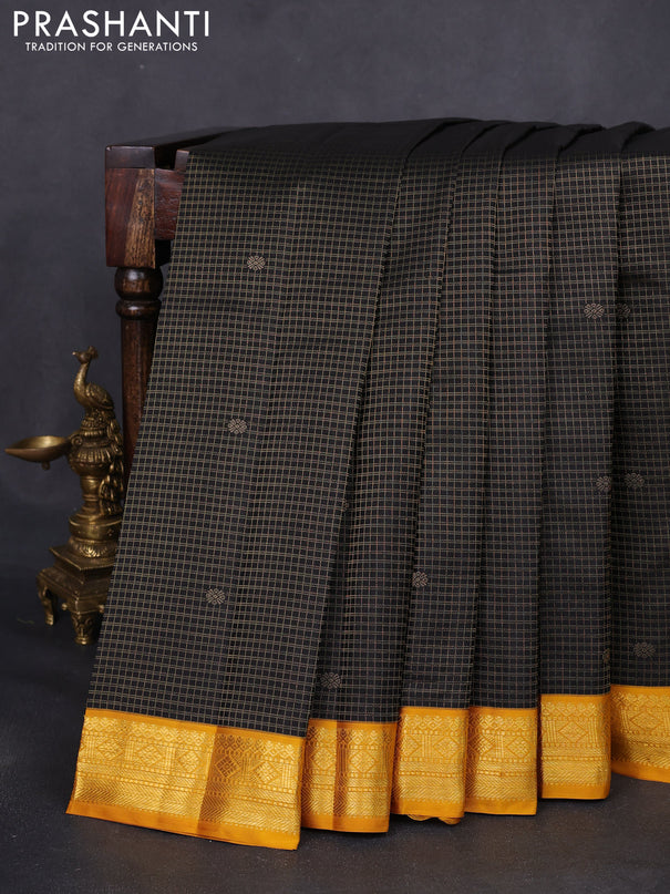 Pure kanchipuram silk saree black and mustard yellow with allover small zari checks & buttas and zari woven korvai border