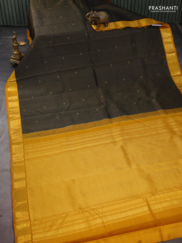 Pure kanchipuram silk saree black and mustard yellow with allover small zari checks & buttas and zari woven korvai border