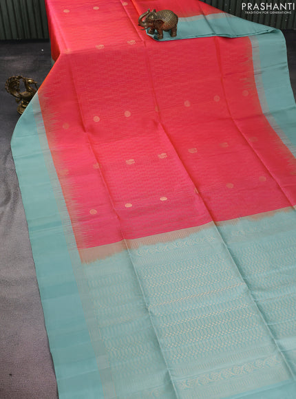 Pure soft silk saree dual shade of pinkish orange and pastel blue with allover zari weaves and zari woven simple border