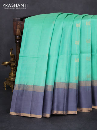 Pure soft silk saree teal green and grey with allover zari weaves and rettapet zari woven border