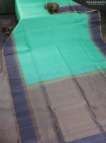 Pure soft silk saree teal green and grey with allover zari weaves and rettapet zari woven border