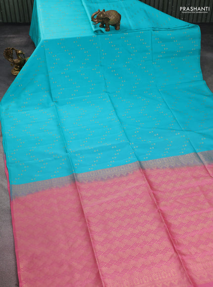 Kanchipuram silk saree teal blue and peach pink with allover zari woven zig zag weaves in borderless style