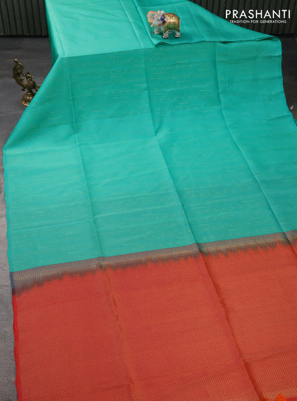 Kanchipuram silk saree teal green shade and dual shade of orange with allover zari weaves in borderless style