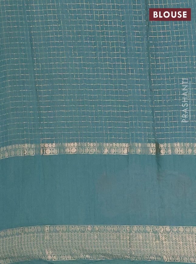 Semi chanderi saree teal blue with allover zari checked pattern and floral embroidery border