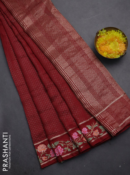 Semi chanderi saree maroon with allover zari weaves and floral embroidery border