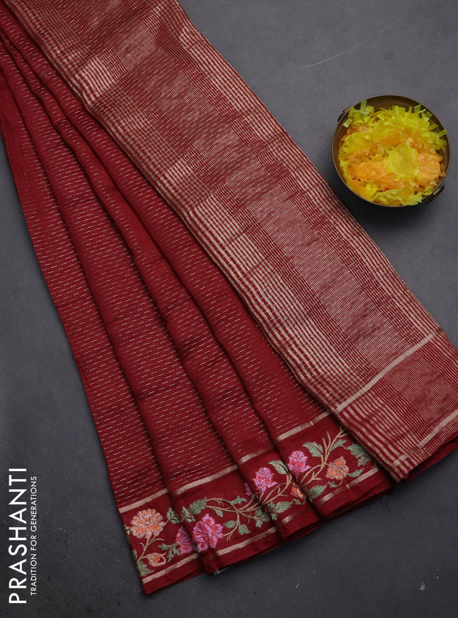 Semi chanderi saree maroon with allover zari weaves and floral embroidery border