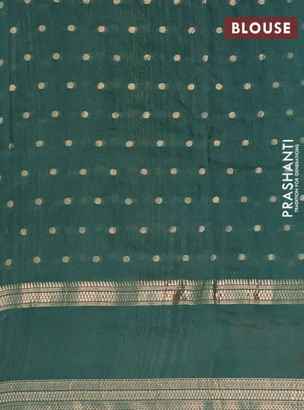 Semi chanderi saree green shade with zari woven buttas and floral embroidery border