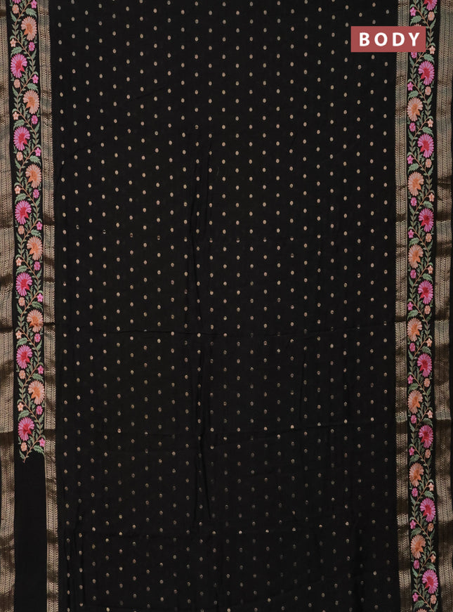 Semi chanderi saree black with zari woven buttas and floral embroidery border
