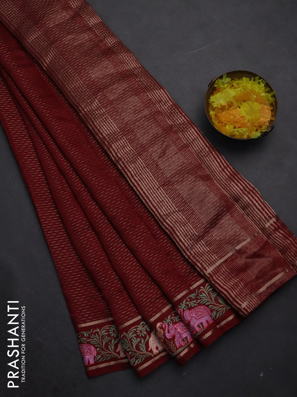 Semi chanderi saree maroon with allover zari weaves and floral embroidery border