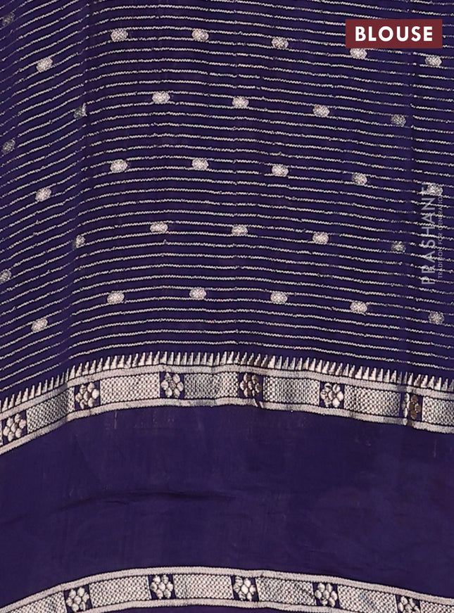 Semi chanderi saree blue with allover zari weaves & buttas and floral embroidery border