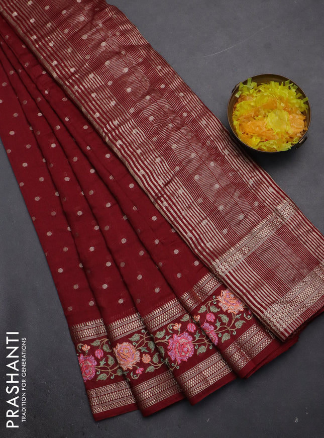 Semi chanderi saree maroon with allover zari woven buttas and floral embroidery border